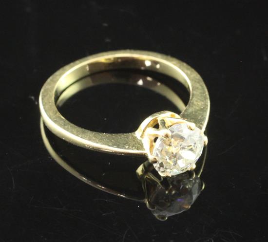 A modern gold and solitaire diamond ring, size L.